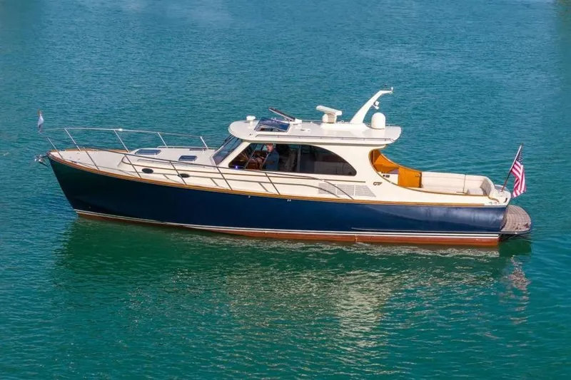 The Image of Luxurious interior of 2015 Hinckley Talaria 43 Motoryacht with elegant wood finish and seating. - 0