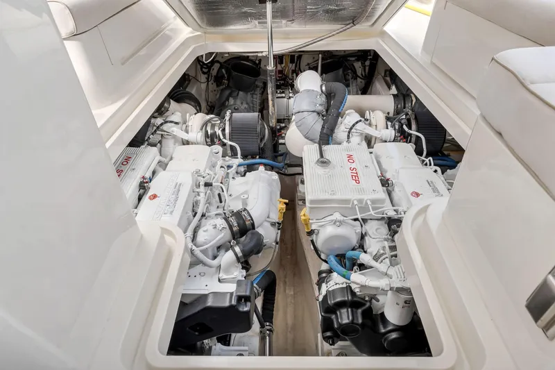 Slide: The Image of Engine room of 2015 Hinckley Talaria 43 Motoryacht, showcasing dual engines and mechanical components. - 12