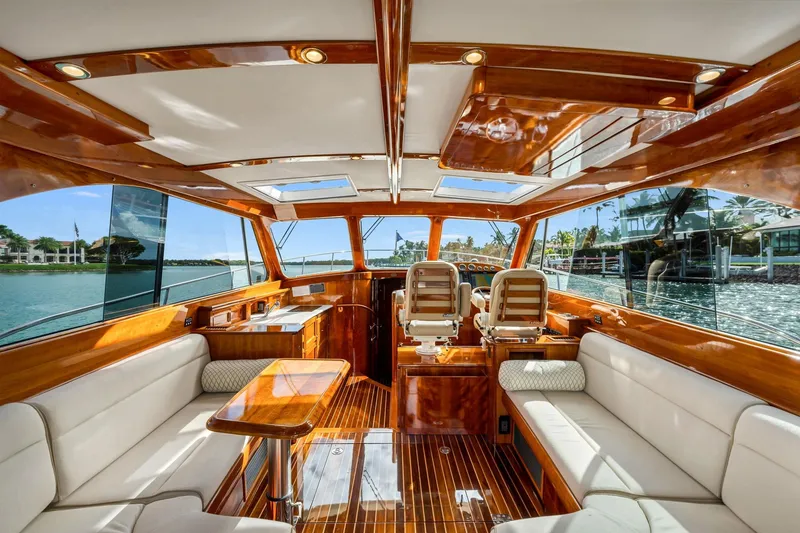 Slide: The Image of Luxurious interior of 2015 Hinckley Talaria 43 Motoryacht with elegant wood finish and seating. - 3