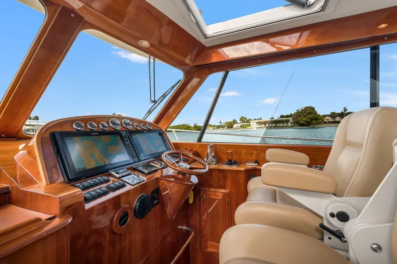 Slide: The Image of Interior of 2015 Hinckley Talaria 43 Motoryacht with luxurious helm and navigation screens. - 7