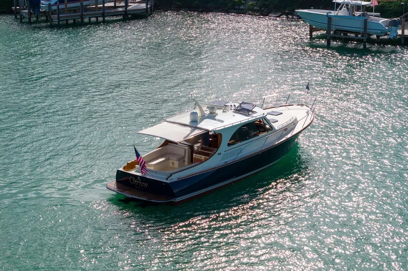 Slide: The Image of 2015 Hinckley Talaria 43 Motoryacht cruising on sparkling water. - 16