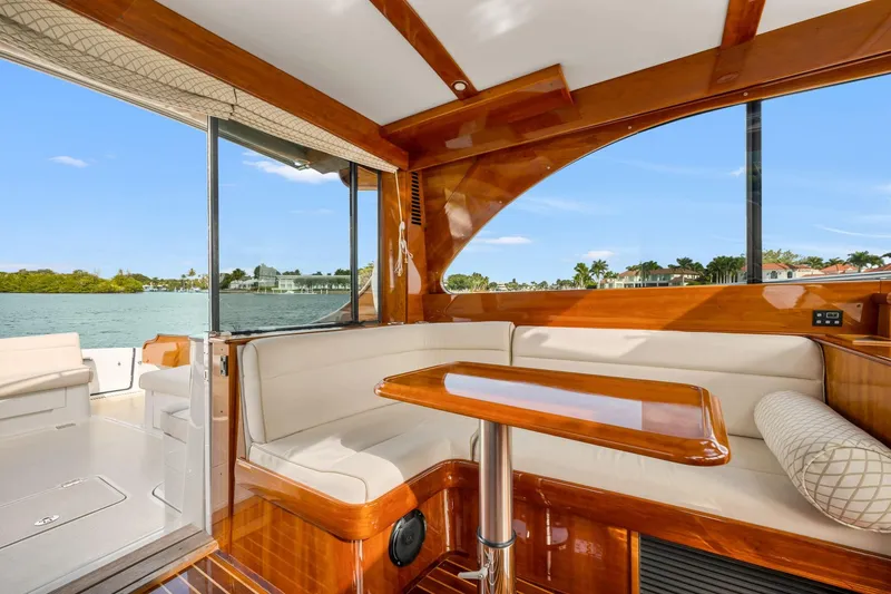 Slide: The Image of Luxurious interior of 2015 Hinckley Talaria 43 Motoryacht with elegant wood finish and waterfront view. - 4