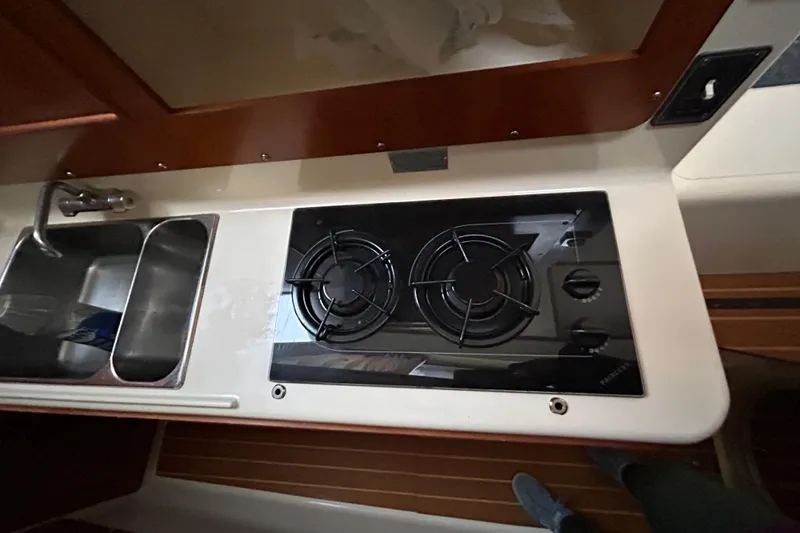 Slide: The Image of Compact kitchen area in 2004 PDQ 34 Power Catamaran with stove and sink. - 19