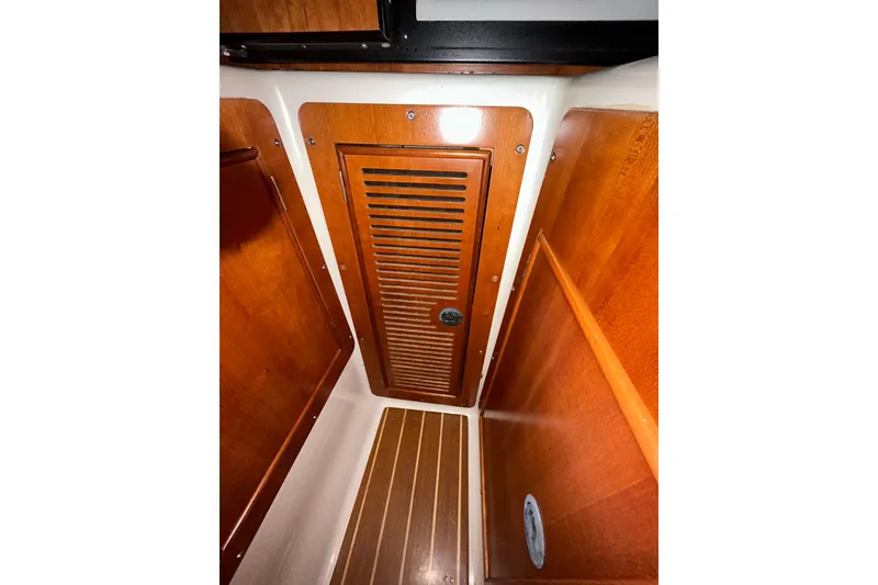 Slide: The Image of Interior view of 2004 PDQ 34 Power Catamaran with wooden cabinetry and flooring. - 21