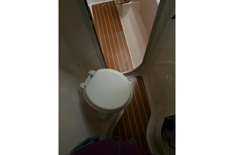 Slide: The Image of Bathroom interior of 2004 PDQ 34 Power Catamaran with wooden flooring. - 32