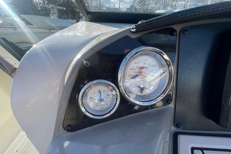 Slide: The Image of Dashboard of a 2021 Stingray 201 DC boat showing speedometer and fuel gauge. - 20