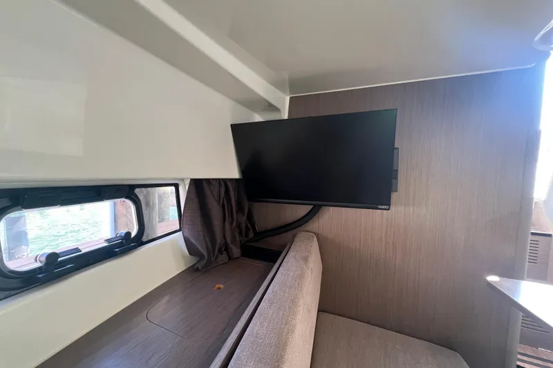 Slide: The Image of Interior of 2024 Beneteau Flyer 9 SUNdeck with TV and window view. - 16
