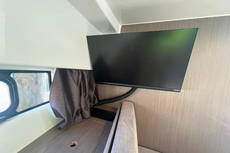 Slide: The Image of Interior of 2024 Beneteau Flyer 9 SUNdeck with mounted Vizio TV. - 17