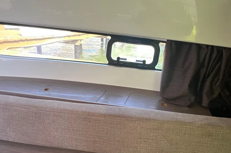 Slide: The Image of Interior view of 2024 Beneteau Flyer 9 SUNdeck with window and curtain. - 21