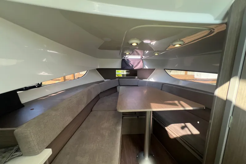 Slide: The Image of 2024 Beneteau Flyer 9 SUNdeck interior with seating and table, modern design. - 23