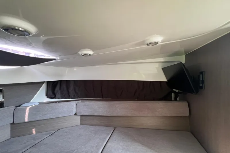 Slide: The Image of 2024 Beneteau Flyer 9 SUNdeck interior cabin with seating and mounted TV. - 31