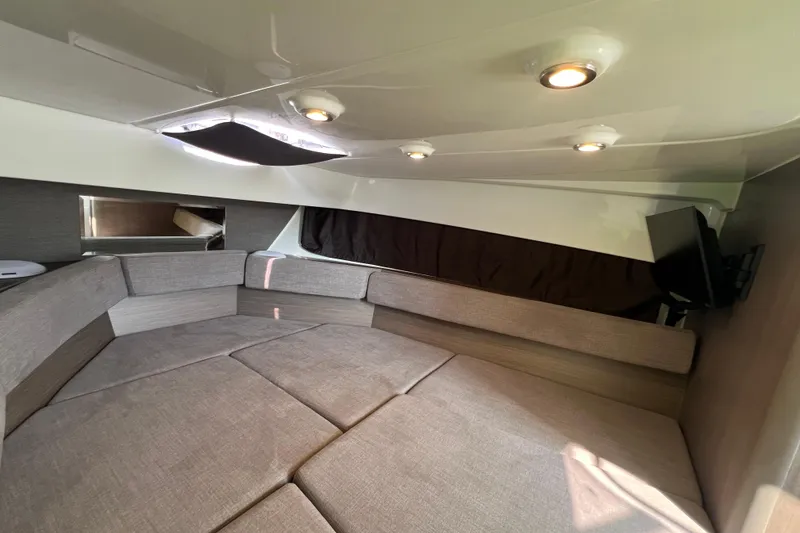 Slide: The Image of 2024 Beneteau Flyer 9 SUNdeck cabin interior with cozy seating and modern lighting. - 32