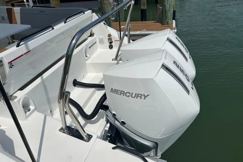 Slide: The Image of 2024 Beneteau Flyer 9 SUNdeck with dual Mercury outboard engines at dock. - 35