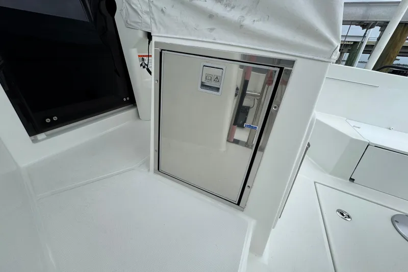 Slide: The Image of 2024 Beneteau Flyer 9 SUNdeck interior detail, featuring sleek white cabinetry and modern design. - 37