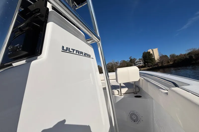 Slide: The Image of 2024 Sea Hunt Ultra 219 boat on water, showcasing sleek design and modern features. - 3