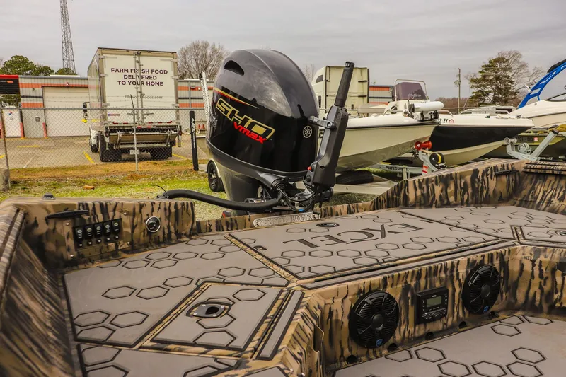 Slide: The Image of 2026 Excel Tomahawk boat with Yamaha VMAX engine in a boatyard. - 8