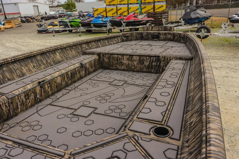 Slide: The Image of 2026 Excel Tomahawk boat with custom interior design in a showroom setting. - 9