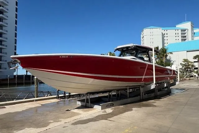 The Image of 2022 Nor-Tech 452 Super Fish boat in vibrant red on calm waters. - 0