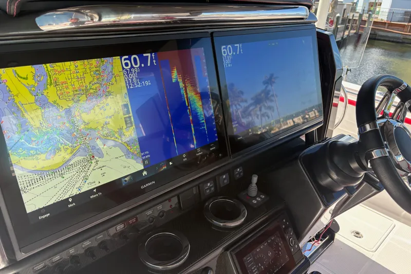 Slide: The Image of Red and white seating on 2022 Nor-Tech 452 Super Fish boat interior. - 10