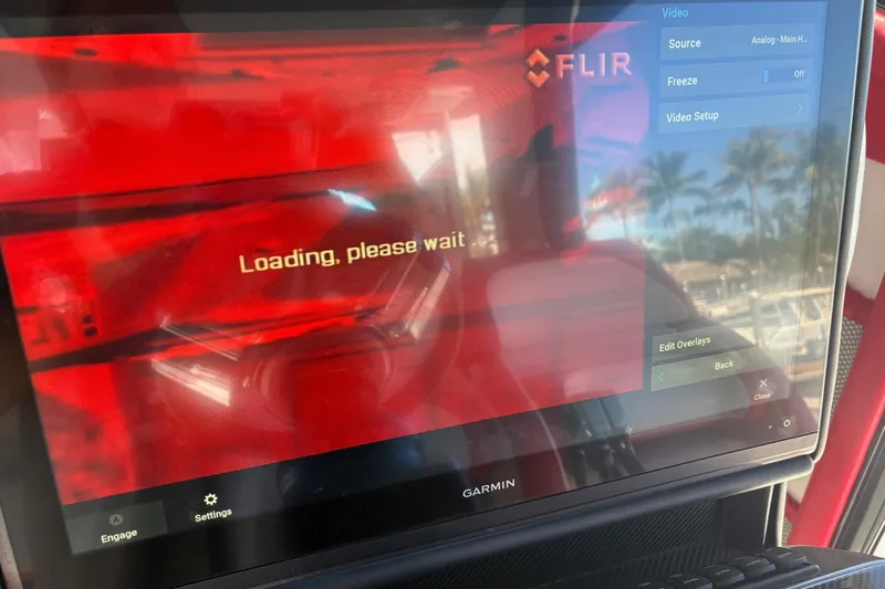 Slide: The Image of 2022 Nor-Tech 452 Super Fish helm with dual screens and modern controls. - 11