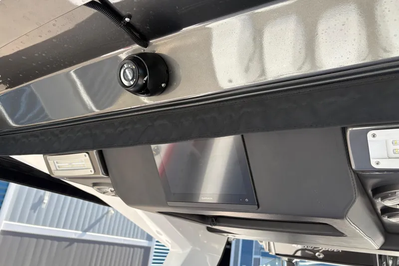 Slide: The Image of 2022 Nor-Tech 452 Super Fish interior storage compartment with red seating and sleek design. - 20