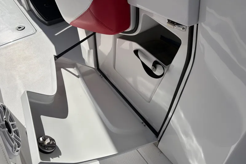 Slide: The Image of 2022 Nor-Tech 452 Super Fish boat dashboard with Garmin display and controls. - 22