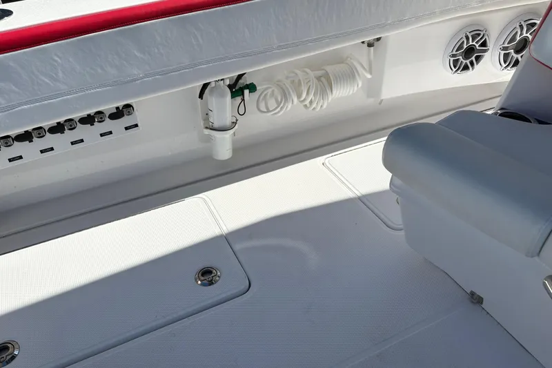 Slide: The Image of 2022 Nor-Tech 452 Super Fish boat interior with red and white seating. - 24
