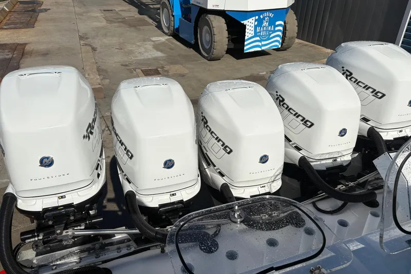 Slide: The Image of 2022 Nor-Tech 452 Super Fish boat interior with seating, speakers, and control panel. - 26