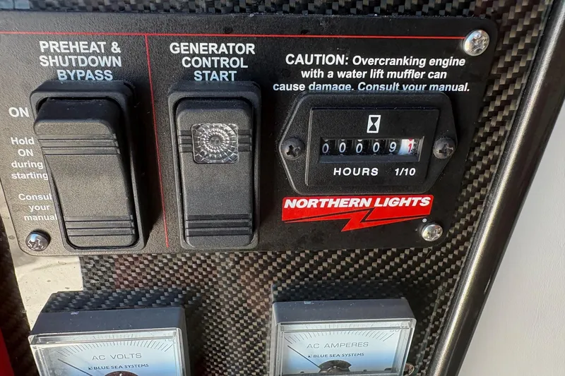 Slide: The Image of Control panel of 2022 Nor-Tech 452 Super Fish with generator and preheat switches. - 33