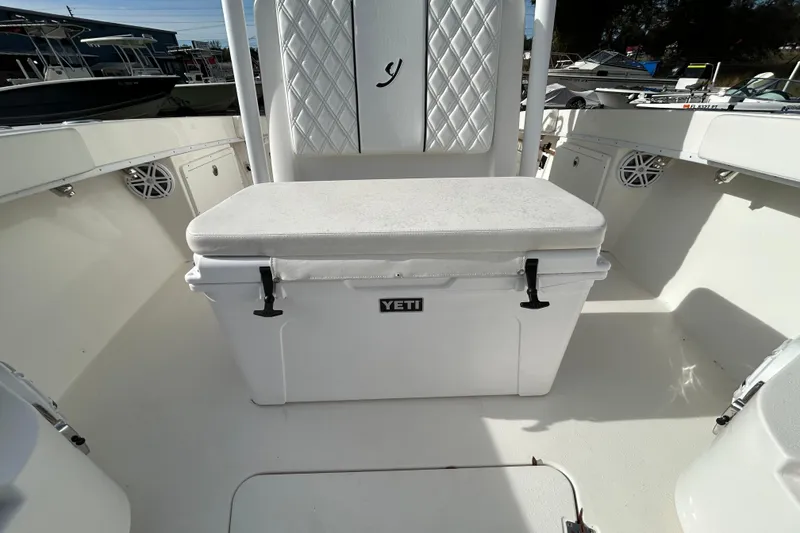 Slide: The Image of 2022 Young Boats 27 interior with Yeti cooler and cushioned seating. - 10