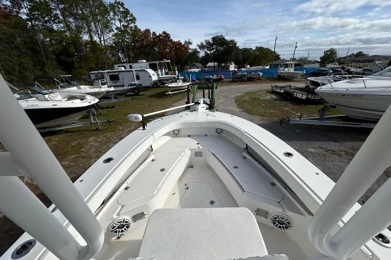 Slide: The Image of 2022 Young Boats 27 model in a boatyard, surrounded by various other boats. - 17
