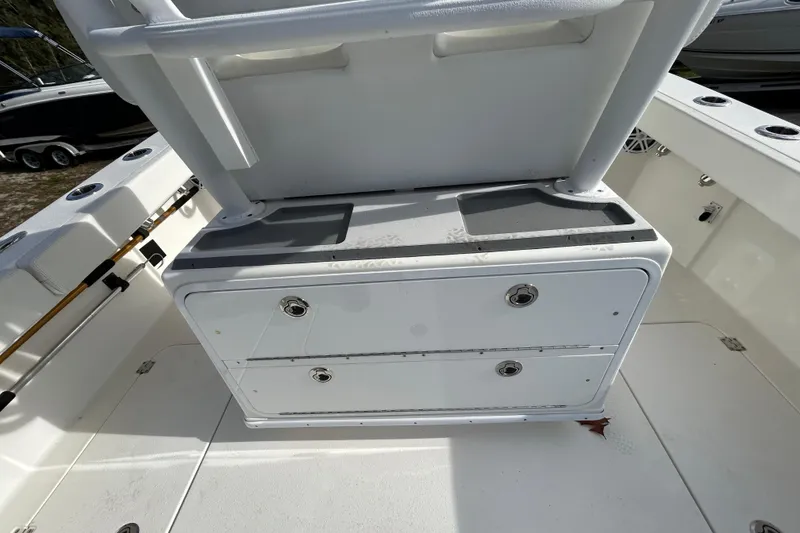 Slide: The Image of 2022 Young Boats 27 interior with storage compartments and seating. - 19