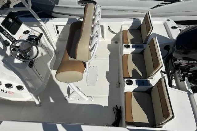 Slide: The Image of 2023 NauticStar 227 XTS boat interior with seating and steering console. - 4