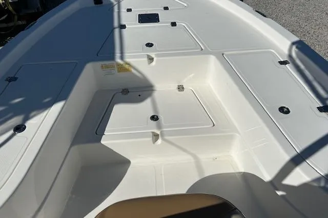 Slide: The Image of 2023 NauticStar 227 XTS boat deck with storage compartments. - 5