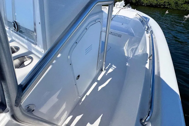 Slide: The Image of 2006 Sea Pro 238 Center Console boat deck with stainless steel railings. - 11