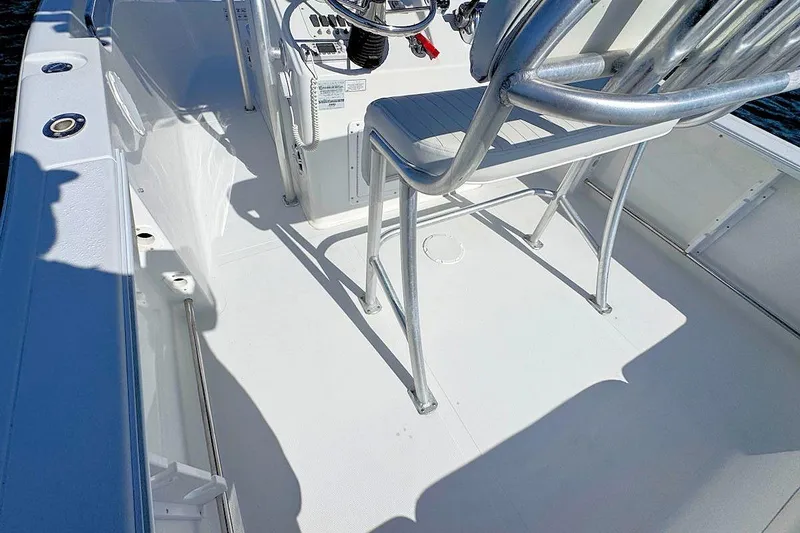 Slide: The Image of 2006 Sea Pro 238 Center Console boat interior with seating and control panel. - 8