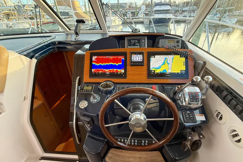 Slide: The Image of Helm of 2013 Tiara Yachts 3600 Coronet with navigation displays and controls. - 17