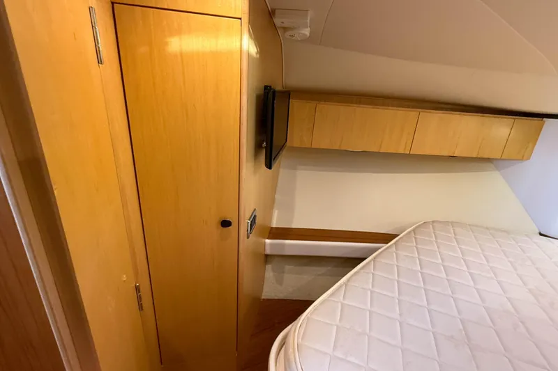Slide: The Image of Interior of 2013 Tiara Yachts 3600 Coronet with wooden cabinetry and mattress. - 22