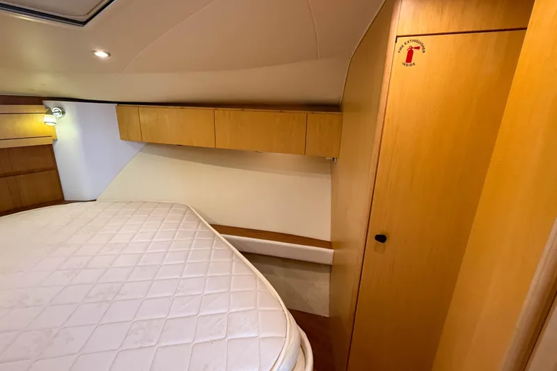 Slide: The Image of Interior cabin of 2013 Tiara Yachts 3600 Coronet with wooden cabinetry and bed. - 23
