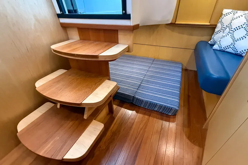 Slide: The Image of 2013 Tiara Yachts 3600 Coronet interior with wooden steps and cozy seating area. - 30