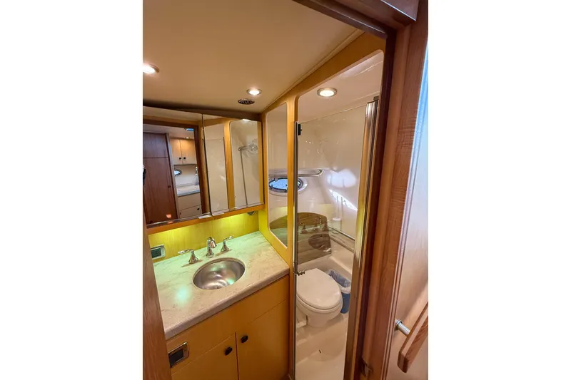 Slide: The Image of 2013 Tiara Yachts 3600 Coronet bathroom with sink, mirror, and shower. - 33