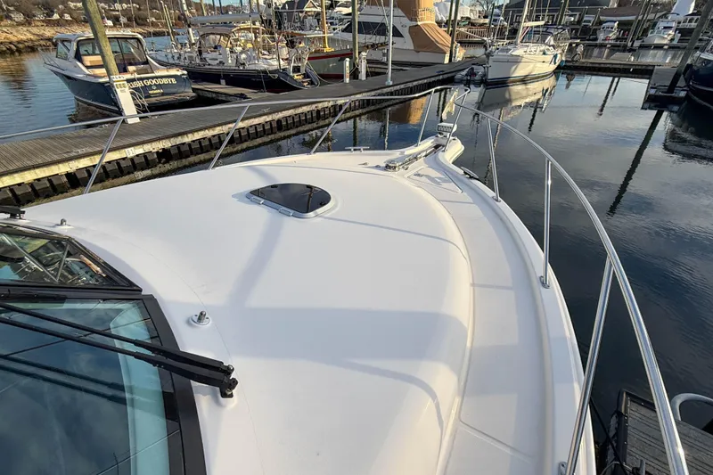 Slide: The Image of 2013 Tiara Yachts 3600 Coronet docked at marina, showcasing sleek deck design. - 34