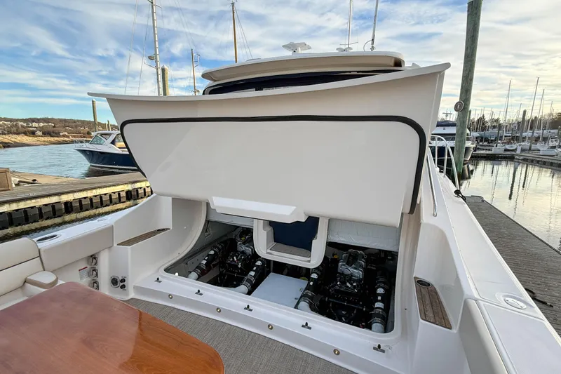 Slide: The Image of 2013 Tiara Yachts 3600 Coronet with open engine compartment at marina. - 39