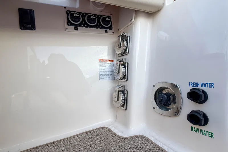 Slide: The Image of Control panel on 2013 Tiara Yachts 3600 Coronet, featuring fresh and raw water access. - 43