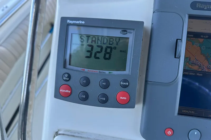 Slide: The Image of Raymarine autopilot display on 2004 Scout 235 Sportfish showing standby mode at 328 degrees. - 25
