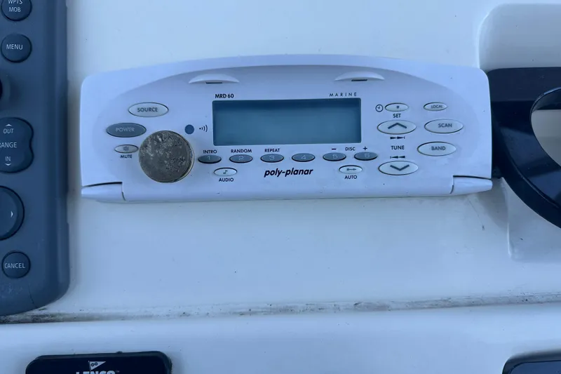 Slide: The Image of Poly-Planar marine stereo on 2004 Scout 235 Sportfish boat dashboard. - 26