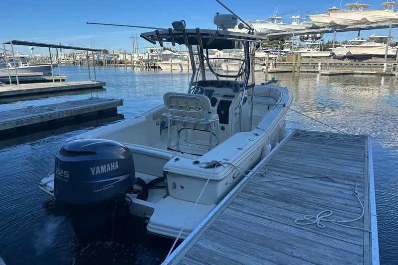 Slide: The Image of 2004 Scout 235 Sportfish boat docked with Yamaha 225 engine. - 4