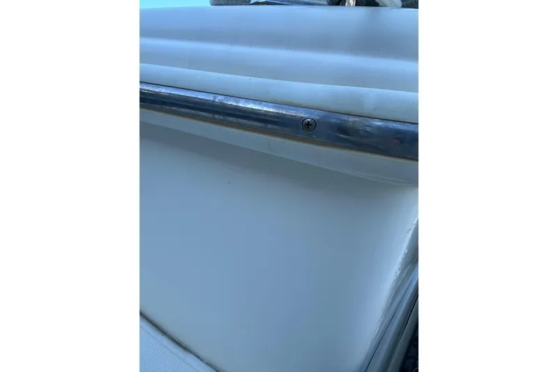 Slide: The Image of Close-up of 2004 Scout 235 Sportfish boat railing and hull detail. - 7