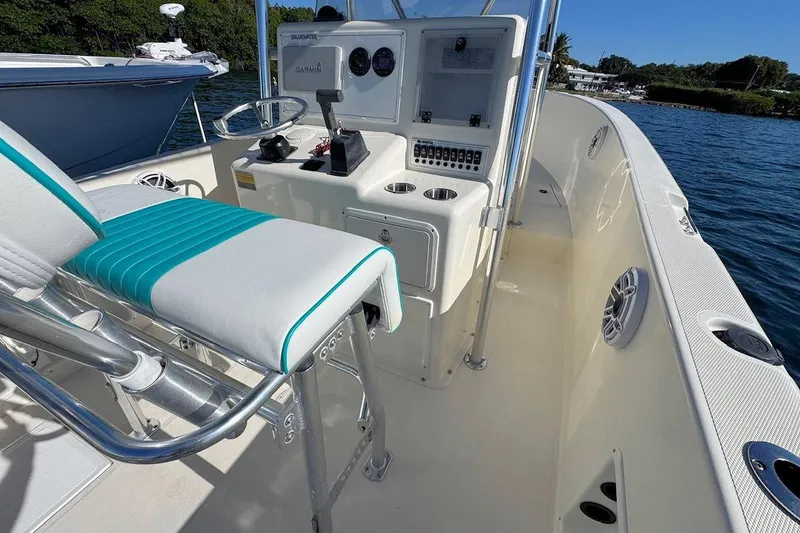Slide: The Image of 2001 Bluewater 2350 boat dashboard with Garmin navigation and Yamaha controls. - 8