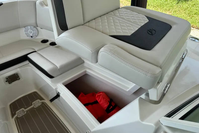 Slide: The Image of 2021 Sailfish 276 DC boat interior with storage compartment and life jacket. - 17